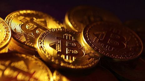 Bitcoin slides to four-month lows, ether sinks 8%